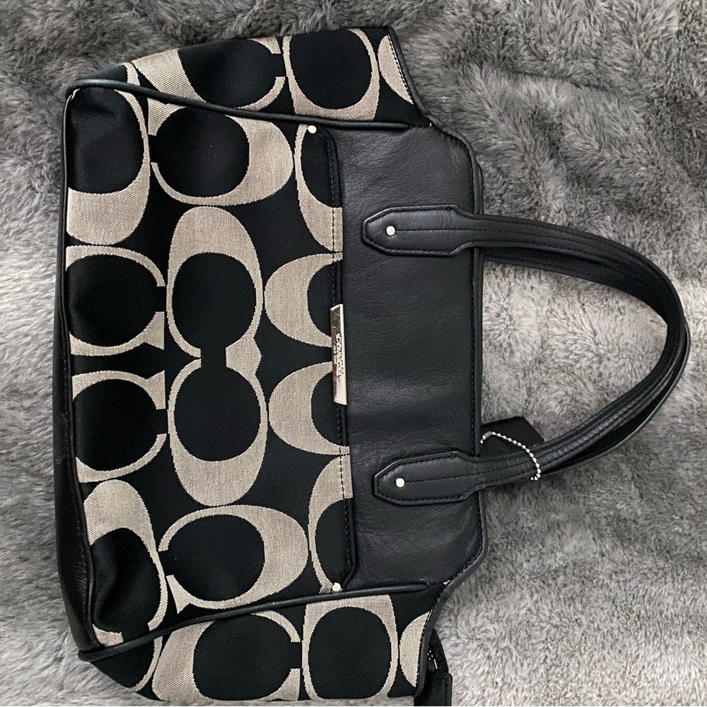 Coach small handbag, used once, excellent condition. Black and tan with leather